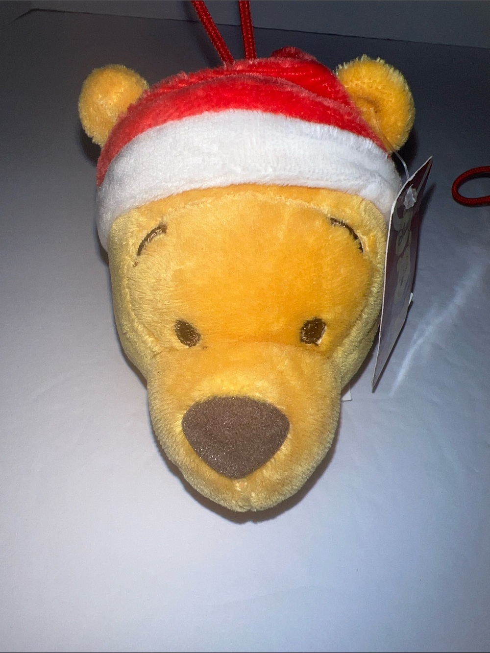 Vintage Disney Winnie the Pooh Plush Ornament in Yellow and Red Santa Hat NWT